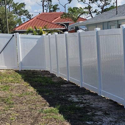 white vinyl fence line